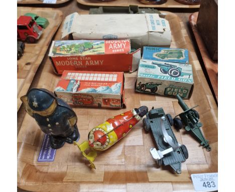 Collection of vintage tinplate and other toys/vehicles to include: clockwork policeman and circus performer, Lonestar Modern 