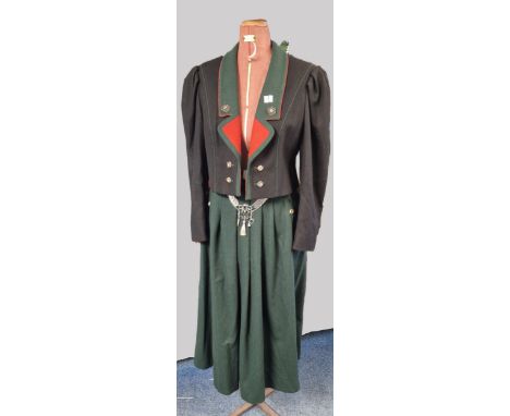 Ladies Austrian style riding suit, with imitation horn buttons, and reindeer chain with replica coins. Jacket is lined and la