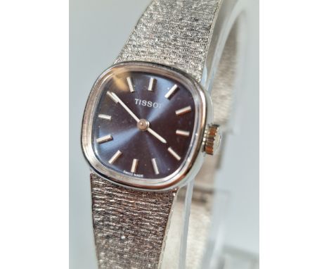 Tissot ladies 9ct white gold quartz bracelet dress watch, with satin blue face, having Baton numerals. Original Tissot box an