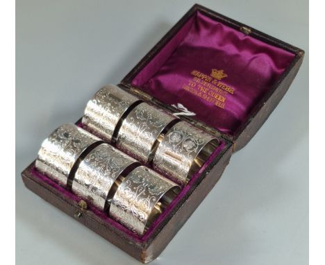 Set of six Victorian silver engraved napkin rings. Sheffield 1884. In Mappin &amp; Webb Silversmiths box. 4.4 troy oz approx.