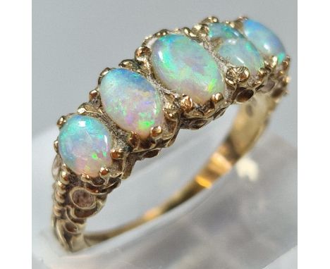 9ct gold five stone opal ring. 3.8g approx. Size R.  (B.P. 21% + VAT)