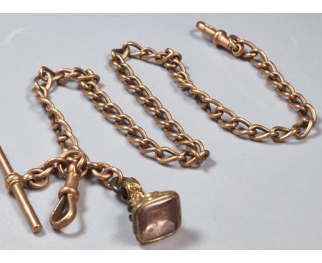 9ct rose gold T bar curb-link Albert pocket watch chain with gilded seal fob. Total weight 31.5g approx.  (B.P. 21% + VAT)