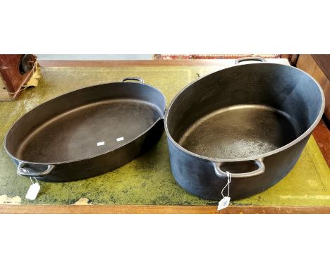 Two similar Holcroft cast iron cooking pots, marked Holcroft 14pts and 24ps. (2) (B.P. 21% + VAT)
