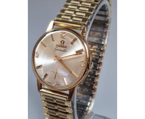 Omega Seamaster copy gold plated gentleman's wristwatch, having satin face with Arabic and Baton numerals, seconds dial and a