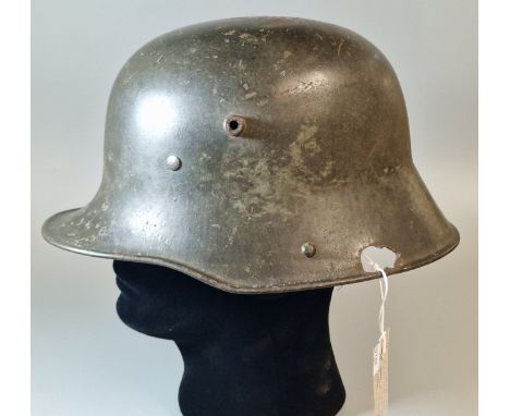 WWI German (Stahlhelm) steel combat helmet, original paint finish. Leather headband and pads. Stamped B379 (B.P. 21% + VAT)  