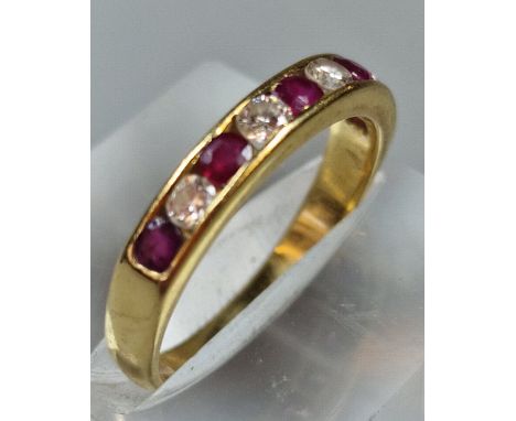 18ct gold nine stone diamond and ruby half eternity ring. 2.8g approx. Size N. (B.P. 21% + VAT)