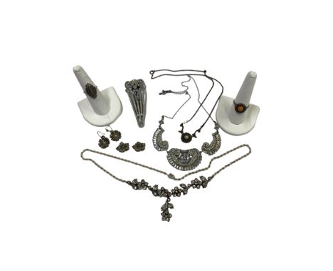 A Selection of silver and silver tone vintage jewellery to include:
A silver and paste necklace, rope chain not original to t