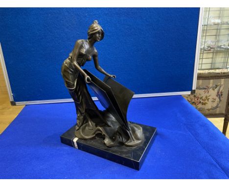 Unusual Art Deco Bronze letter rack mounted on a marble base of a woman holding an open folder  Signed: Milo Height: 37 cms a