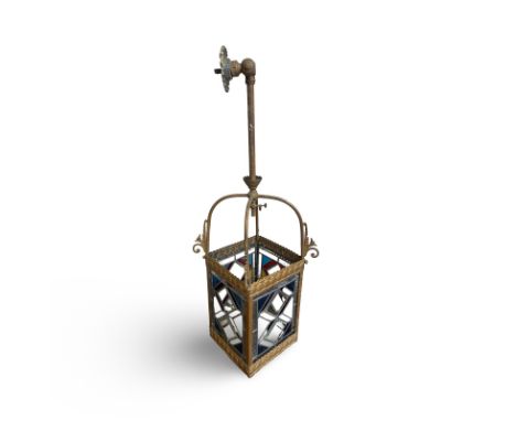 A large early 20th century stained glass hanging lantern with gas fitting.  Lead mounted stained glass with conjoined diamond