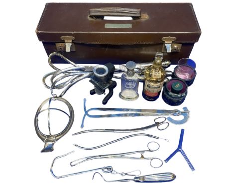 An early 20th century portable doctors kit in a leather box with various medical equipment Includes a mask, empty chloroform 