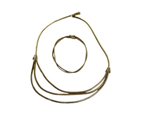 18ct necklace and bracelet set.
The necklace is marked 750 and is crafted in a white, yellow and rose brushed 18ct gold Omega