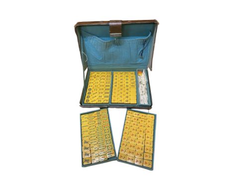 Leather cased art-deco period Mah-Jong set. Complete set of 144 Bakelite tiles and one spare blank tile. Complete with gaming