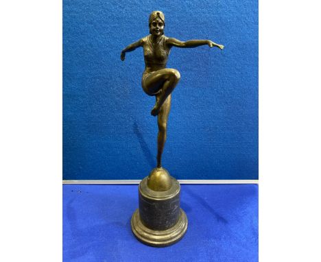 Art Deco Bronze of a lady standing on one leg on a semi-sphere with a raised knee and outstretched arms mounted on a marble b