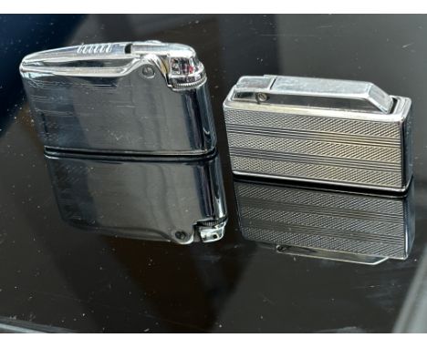 Colibri cigarette lighter & 1 other (1 with soft case & 1 with hard case)