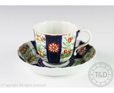 A Worcester porcelain coffee cup and saucer circa 1770, the fluted cup and saucer each decorated in a kakiemon pattern in cob