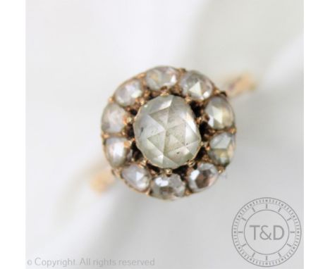 A rose cut diamond set cluster ring, designed as a circular cluster with central rose cut surrounded by ten further rose cut 