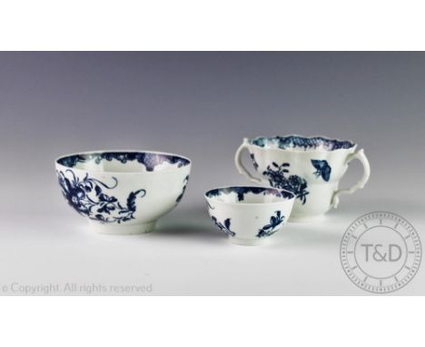 An 18th century Worcester chocolate cup circa 1770, the two handled ogee cup printed in blue with the Three Flowers pattern, 