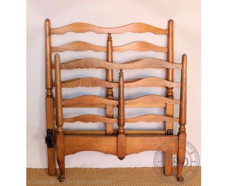 A pair of Heals and Son oak ladder back single beds, on cabriole and block legs, each with makers label, 116cm H x 93cm W   C