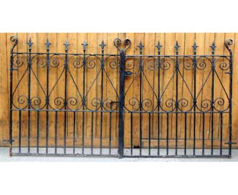 A pair of cast and wrought iron garden gates, with scroll detailing, each gate is 124.5cm W x 135cm H, the size does not incl