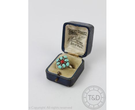 A turquoise and coral coloured dress ring, all set in white metal stamped '925', weight 5.5gms  