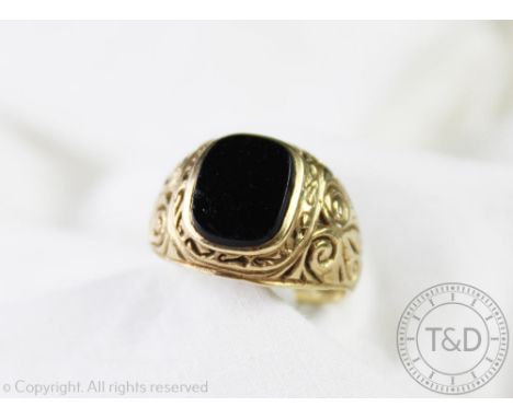 A gentleman's 9ct gold and onyx signet ring, with engraved detailing, 5.7gms gross CONDITION REPORT: This ring is a size R. S