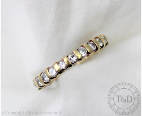 A diamond set full eternity ring, set throughout with brilliant cut diamonds and set in yellow metal, size L, gross weight 3.