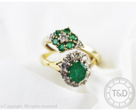 Two diamond and emerald rings, comprising; an oval cluster ring with central emerald and diamond set surround, all set in yel