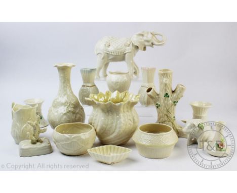 A selection of Belleek China including a tree trunk spill vase, 16.5cm high, a pair of short vases, 7cm high, a model elephan