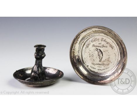 A novelty silver chamber stick, Charles Edwin Turner, Birmingham 1934, modelled a cat within a bowled drip tray, 6cm high and