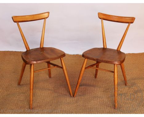 A pair of Ercol beech chairs, with solid seats, on turned legs, 74cm H