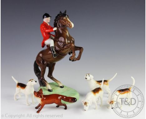 A Beswick part hunting set comprising; a rearing hunter and huntsman model No.868, 24cm high, four hounds and a fox (6)   CON