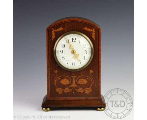 An Edwardian inlaid mahogany mantel time piece, with eight day movement, 23cm, with a Danish pewter pedestal bowl, the column