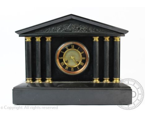 A Victorian black slate architectural mantel clock, with Roman numeral chapter ring and movement striking on a bell, 30cm hig