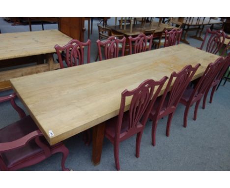 A large elm four plank table top, on associated oak base, the top 86cm wide x 299cm long x 65cm deep.