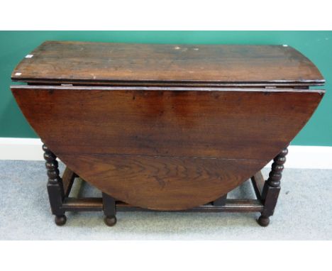 A late 17th century oak gate-leg table on bobbin turned supports, 116cm wide x 52cm long x 153cm long opened.