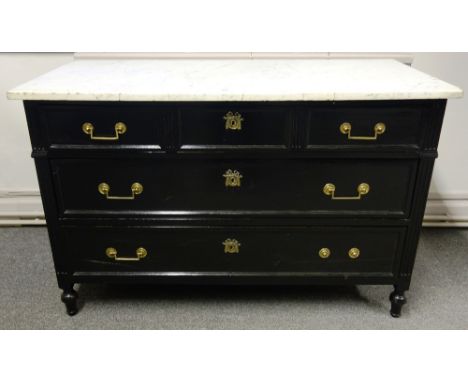 A 19th century French commode, the marble top over an ebonised three drawer base, 134cm wide x 61cm deep.
