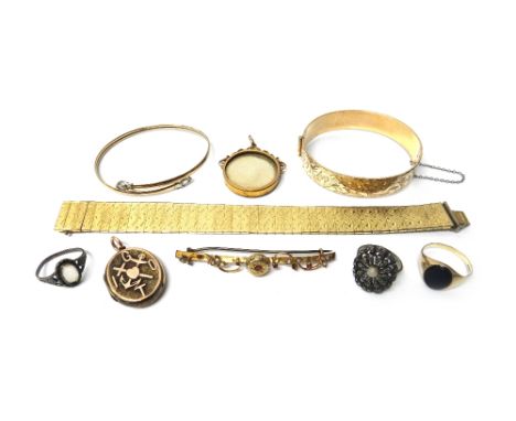 A gold, seed pearl and garnet set bar brooch, a gold mounted and seed pearl set circular pendant locket, glazed with the port
