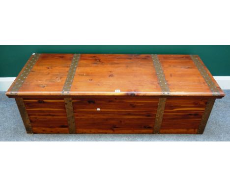 A 20th century American metal bound rectangular cedar wood trunk, 142cm wide x 43cm high.