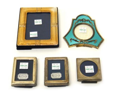 A silver and pale blue enamel mounted triangular shaped strut back photograph frame, having a circular aperture and with ribb