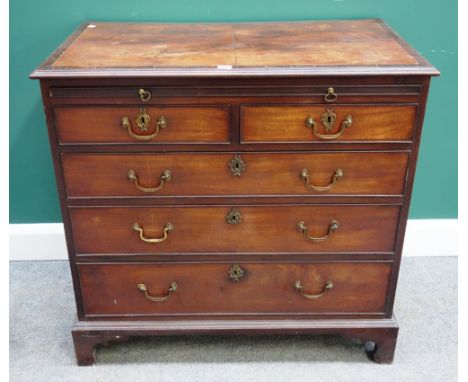 A George III mahogany chest, with brushing slide over two short and three long graduated drawers, on bracket feet, 90cm wide 