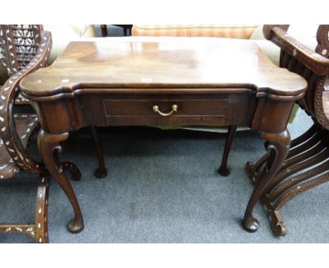 A George II and later mahogany card table, with shaped top inset with gaming wells, on cabriole supports, 86cm wide x 72cm hi