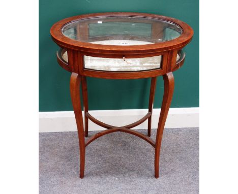 A late 19th century satinwood banded mahogany oval bijouterie table, 61cm wide x 77cm high.