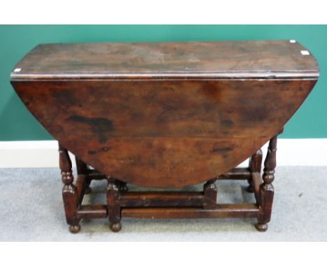 A late 17th century early 18th century yew wood gate-leg table, 103cm wide x 38cm long x 127cm long opened. 