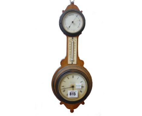 A French oak cased clock/barometer of 'banjo' form, 19th century, 36cm high, the clock dial detailed 'HENRY MARC A PARIS'. 