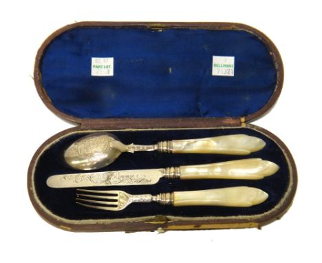 A Victorian silver three piece christening set, comprising; a knife, a fork and a spoon, having engraved decoration and with 