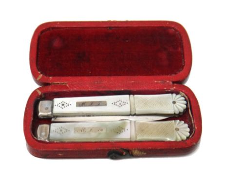A William IV silver and mother of pearl travelling folding fruit knife and fork, the blade and the prongs, Sheffield 1830, th