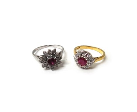 A gold, ruby and diamond set cluster ring, claw set with a circular cut ruby at the centre, in a surround of circular cut dia