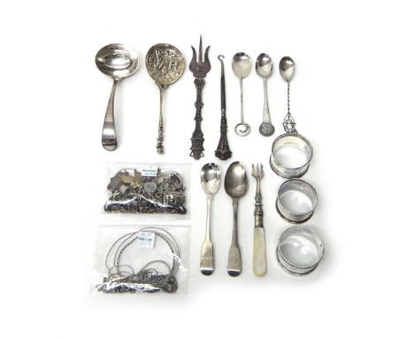 Two silver napkin rings, a Sterling silver napkin ring, four silver spoons, a silver and mother of pearl pickle trident, Birm
