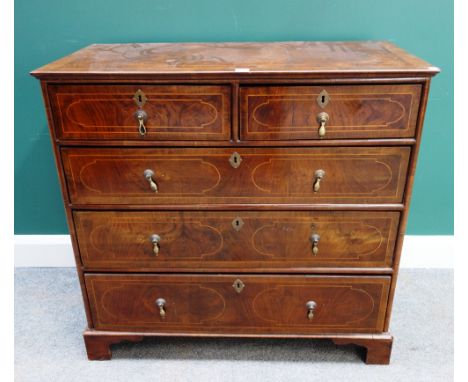 An early 18th century and later walnut chest of two short and three long drawers, on bracket feet, 94cm wide x 90cm high.