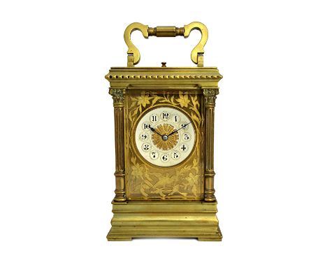 A French brass cased carriage clock, circa 1900, with hour push repeat and visible platform escapement, the dial plate with a